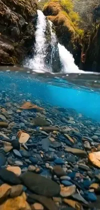 Get lost in the peace and tranquility of a stunning waterfall with this phone live wallpaper