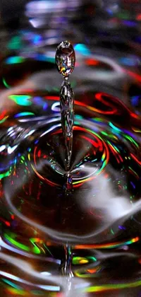 This holographic live wallpaper features a close-up shot of a water drop in a sink