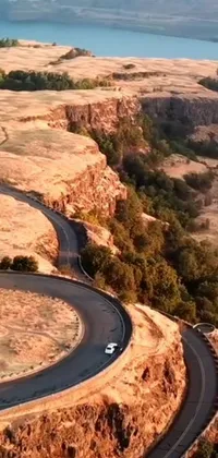 Experience the thrill of a scenic drive with this phone live wallpaper