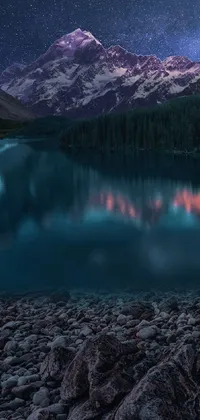 This phone live wallpaper captures the surreal beauty of nature with a mountain standing tall in the background while glowing stars and a shimmering moon light up the shores of a large body of water