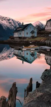 This phone live wallpaper showcases two charming houses set against a serene body of water