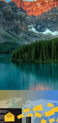 This live wallpaper depicts a laptop sitting on a desk in front of a majestic mountain backdrop