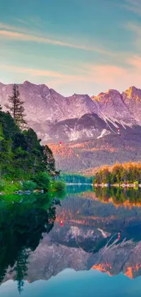 Impress your friends and family with this amazing live wallpaper that features a serene body of water and majestic mountains in the background