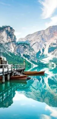 This live wallpaper showcases a serene view of a dock in the middle of a beautiful lake with mountains in the background