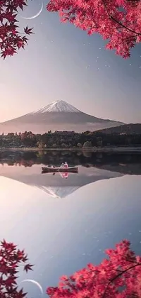 This phone live wallpaper features a stunning scene of a large body of water with a mountain in the background