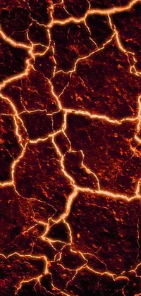 This phone live wallpaper showcases the mesmerizing image of a fire hydrant atop a lava-covered ground, captured in microscopic detail