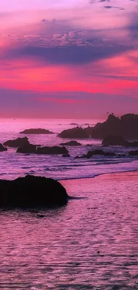 "Experience the breathtaking beauty of nature with our "Pink Sunset Over the Ocean" phone live wallpaper