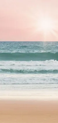 This live wallpaper features a person walking on a beach carrying surfboards, with waves crashing on the shore behind them