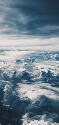 This phone live wallpaper features a surreal view of clouds seen from an airplane