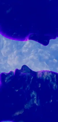 This phone live wallpaper features a beautiful digital art landscape of two people standing next to each other against a blue and purple cloudscape