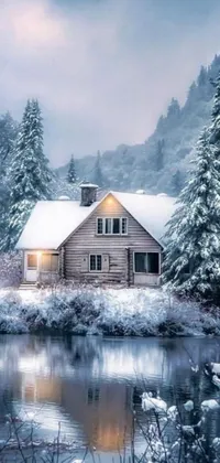 Looking for a cozy winter-themed live wallpaper for your phone? Check out this cabin-in-the-forest wallpaper