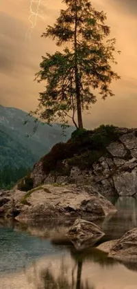 This live wallpaper for your phone is a breathtaking matte painting showcasing a mountain scene at dusk