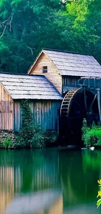 Transform your phone screen with this stunning live wallpaper featuring a charming wooden building by a pristine waterbody