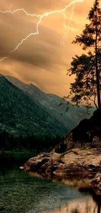 Find peace and thrill in nature with this phone live wallpaper showcasing a tree, rock, and lake in a mountain forest against a backdrop of storm clouds