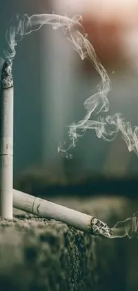 This captivating live wallpaper features a realistic image of a lit cigarette with smoke trailing from it
