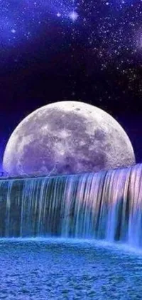 This live phone wallpaper showcases a majestic waterfall in the foreground, juxtaposed with a full moon in the backdrop