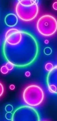 This live wallpaper features colorful circles on a black background, inspired by Lisa Frank