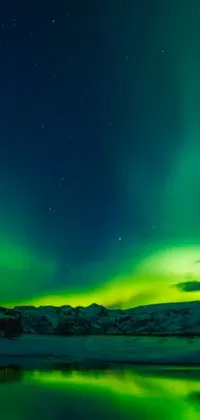 This phone live wallpaper depicts the serene beauty of aurora lights shining over a water body on a sunny day