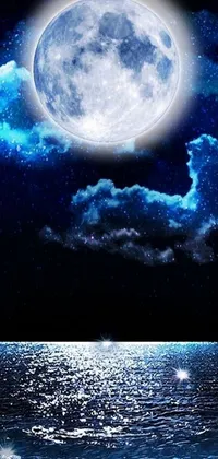 This live phone wallpaper depicts a serene full moon in a starry night sky above a reflective body of water