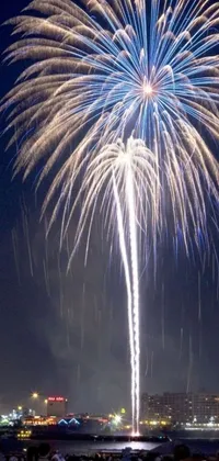 Captivating phone live wallpaper depicting a group of people watching a breathtaking fireworks display