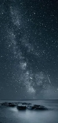 This phone live wallpaper showcases a captivating black and white photo of the night sky, featuring amoled colors and a galaxy theme