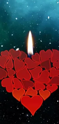 This phone live wallpaper features a heart-shaped candle surrounded by smaller hearts on a universe-themed background