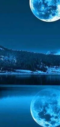 This phone live wallpaper displays a serene landscape with a full moon over a lake and mountain in the background