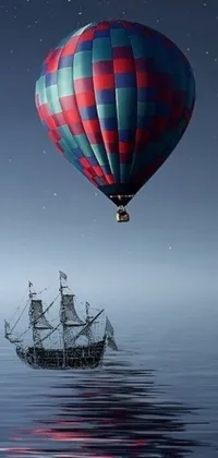 If you're looking for a stunning live wallpaper for your mobile phone, check out this one! It features a boat floating on the water next to a hot air balloon in a beautifully detailed digital rendering