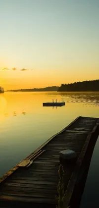 This phone live wallpaper captures a beautiful and tranquil scene of a boat on a lake, with a wooden dock in view