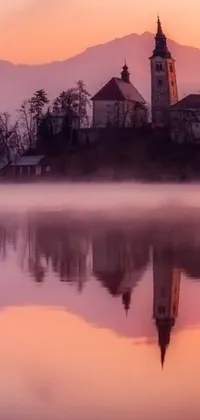This charming live wallpaper showcases a church on an island in the center of a calm lake