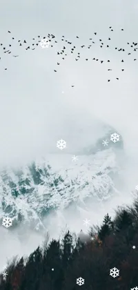 Bring the majesty of a snow-covered craggy mountain to life on your phone with this stunning live wallpaper