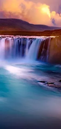 This stunning live wallpaper captures the beauty of a waterfall surrounded by crystal-clear blue waters at dusk