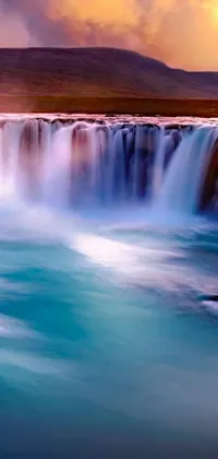 Unleash the beauty of nature on your phone with this lively waterfall wallpaper