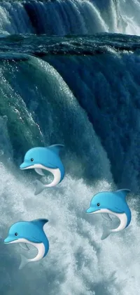 This live mobile wallpaper showcases three dolphins swimming gracefully in front of a stunning waterfall