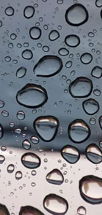Transform your phone's home screen with a stunning live wallpaper that captures the intricate details of water droplets on a windshield