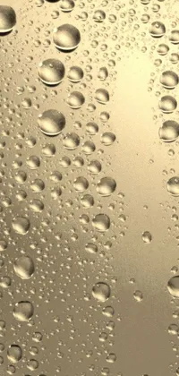 This Phone Live Wallpaper features a close-up view of water droplets on a surface, inspired by the artist's work