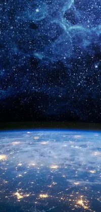Looking for a stunning live wallpaper for your phone? Look no further than this fantastic view of the earth from space at night! This beautiful image captures the beauty of our planet as seen from far above, with a captivating starry sky and shimmering city lights