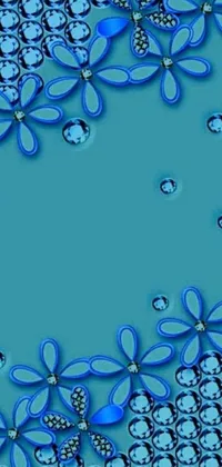 This phone live wallpaper showcases a group of blue flowers placed on a blue surface against a background image