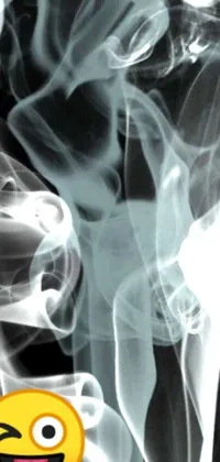 Get swept away by this captivating phone live wallpaper! Depicting a black and white photograph of smoke, this digital art creation features a smiley face and ultrafine detail