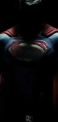 This live phone wallpaper boasts an impressive image of a superhero, dressed in the iconic Superman suit, set against a dark background for maximum impact