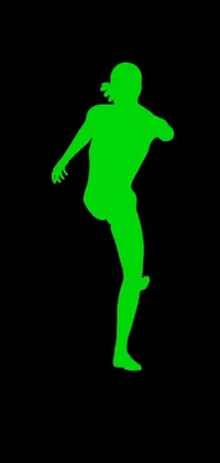 This phone live wallpaper displays a striking silhouette of a person kicking a soccer ball