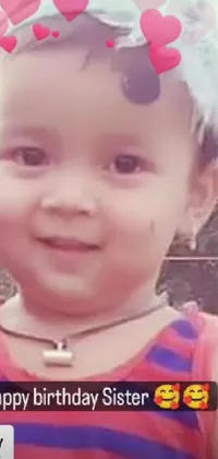 This live wallpaper for your phone features an adorable close-up of a child using a cell phone