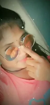 This lively phone live wallpaper features a close up of a person with sunglasses, wearing tachisme-inspired attire and a teenage avatar image