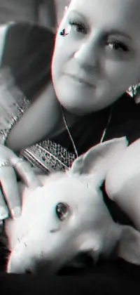 This phone live wallpaper showcases an mesmerizing black and white photograph of a woman holding her dog, with an anaglyph filter that creates a 3D effect