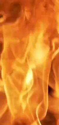 Experience the mesmerizing sight of a dynamic burning fire with this close-up live wallpaper for your phone