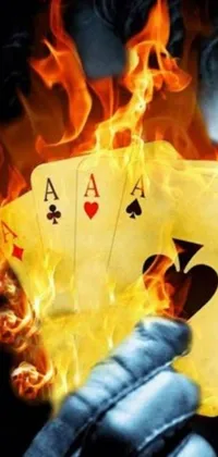 This phone live wallpaper is a captivating scene of a close-up burning playing card engulfed in flames with an online casino logo