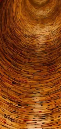This stunning phone live wallpaper features a towering stack of books made of wood that creates an intriguing energy vortex