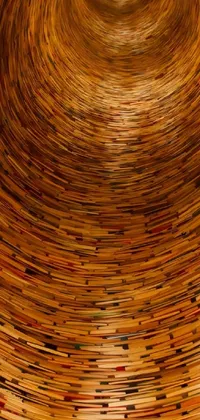 Looking for a stunning and richly detailed live wallpaper for your phone? Look no further than this amazing design featuring a book shelf filled with a myriad of books arranged in a gorgeous and eye-catching pattern