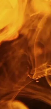 Experience the mesmerizing beauty of yellow smoke in this stunning live wallpaper for your phone