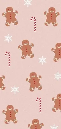 This live phone wallpaper boasts an adorable pattern of gingerbread cookies and candy canes set on a delightful pink background